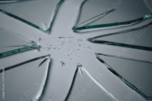 Broken glass pile pieces of texture and background isolated on white, cracked window effect. Emergency condition. © Yuliia