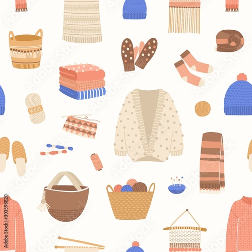Knitted items vector seamless pattern. Cute and warm winter clothes backdrop. Skein of wool, knitting needles, yarn basket, woolen jumper, hand made scarf and cardigan. Knitwear background.