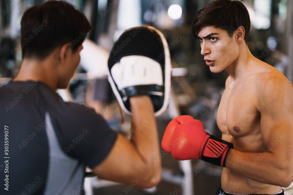 Fototapeta Coach thai are training men boxer with boxing glove at the gym, fitness, boxing camp.