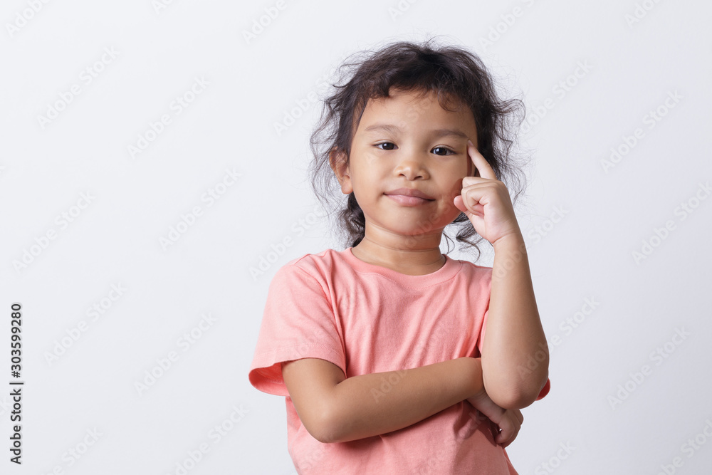 Asian little girl thinking while standing on white background Asian little girl thinking while standing on white background
