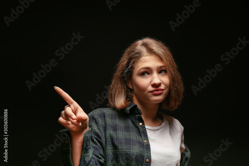 Obraz na plátně Emotional teenage girl on dark background