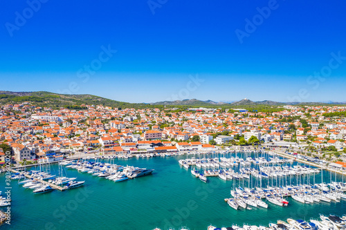 Fototapeta Naklejka Na Ścianę i Meble -  Town of Vodice, marina and turquoise coastline on Adriatic coast, aerial view, Croatia