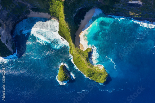 Aerial view at sea and rocks. Azure water background from top view. Kelingking beach, Nusa Penida, Bali, Indonesia. Travel Asia - image