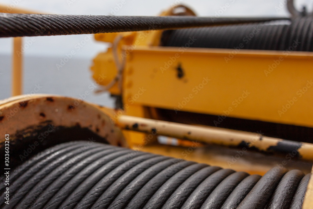 Wire rope sling or cable sling on crane reel drum or winch roll of crane the lifting machine in heavy industrial Wire rope sling or cable sling on crane reel drum or winch roll of crane the lifting machine in heavy industrial