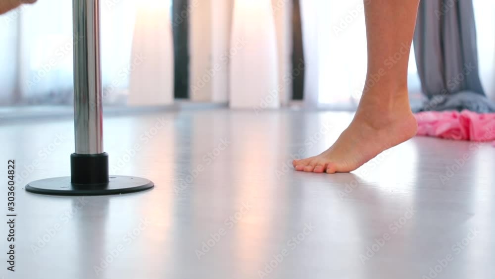 The dancer shows the dance elements on the pylon. The dancer shows the dance elements on the pylon.