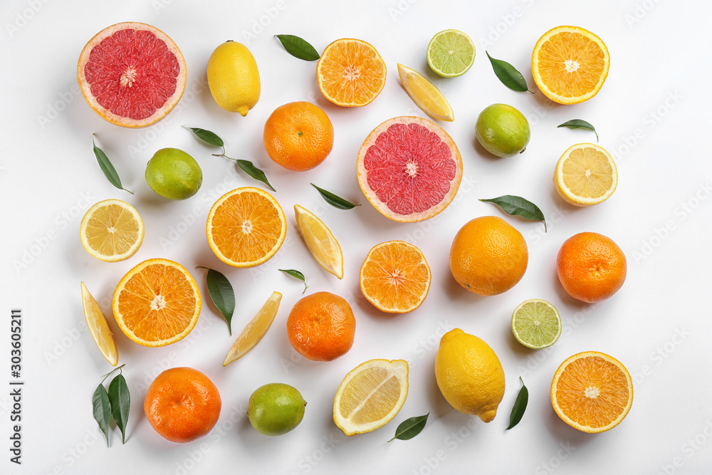Flat lay composition with tangerines and different citrus fruits on white background Flat lay composition with tangerines and different citrus fruits on white background
