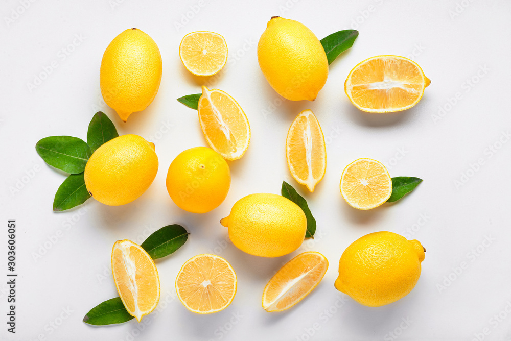 Ripe lemons on white background - obrazy, fototapety, plakaty 