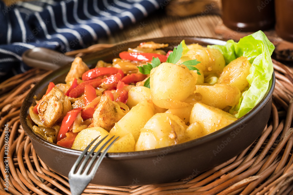 Fried pieces of chicken with red peppers and onions. Fried pieces of chicken with red peppers and onions.