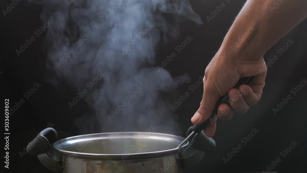 The steam from the vegetable colander in the dark The steam from the vegetable colander in the dark