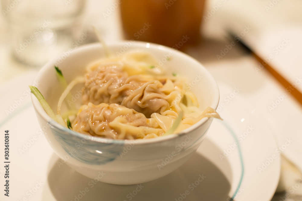 pork and parmesan flavoured with truffle dumpling with cucumber slices pork and parmesan flavoured with truffle dumpling with cucumber slices