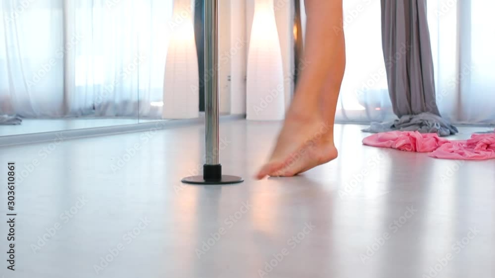 Professional dancer shows movements on the pylon. Professional dancer shows movements on the pylon.