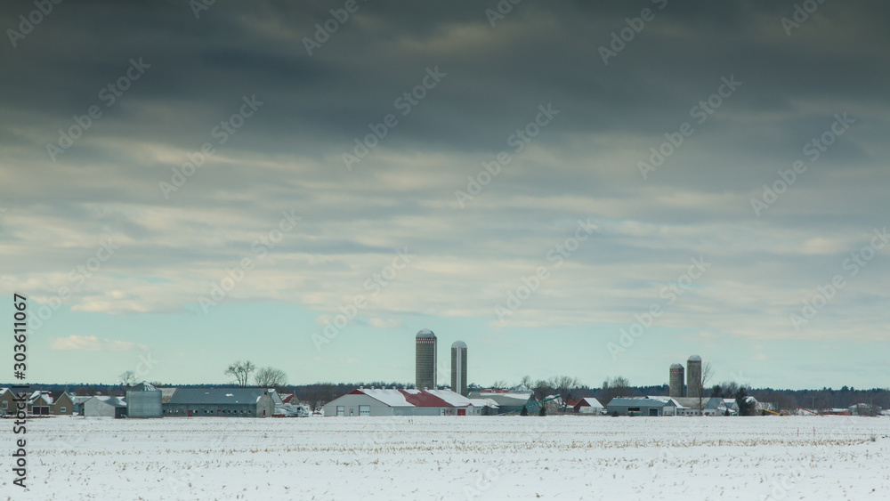 Rural landscape with large farms in winter