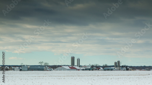 Rural landscape with large farms in winter
