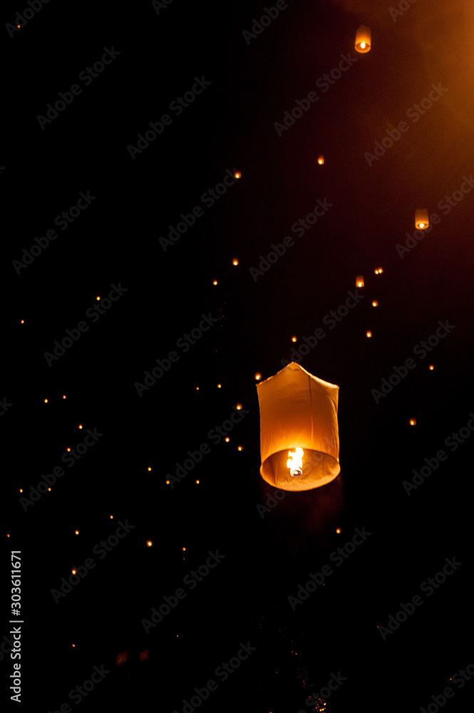 Sky lanterns, flying lanterns, floating lanterns, hot-air balloons on dark  night sky with moon. New year and Yeepeng festival in Thailand. Chiang Mai,  Northern Thailand. Photos | Adobe Stock