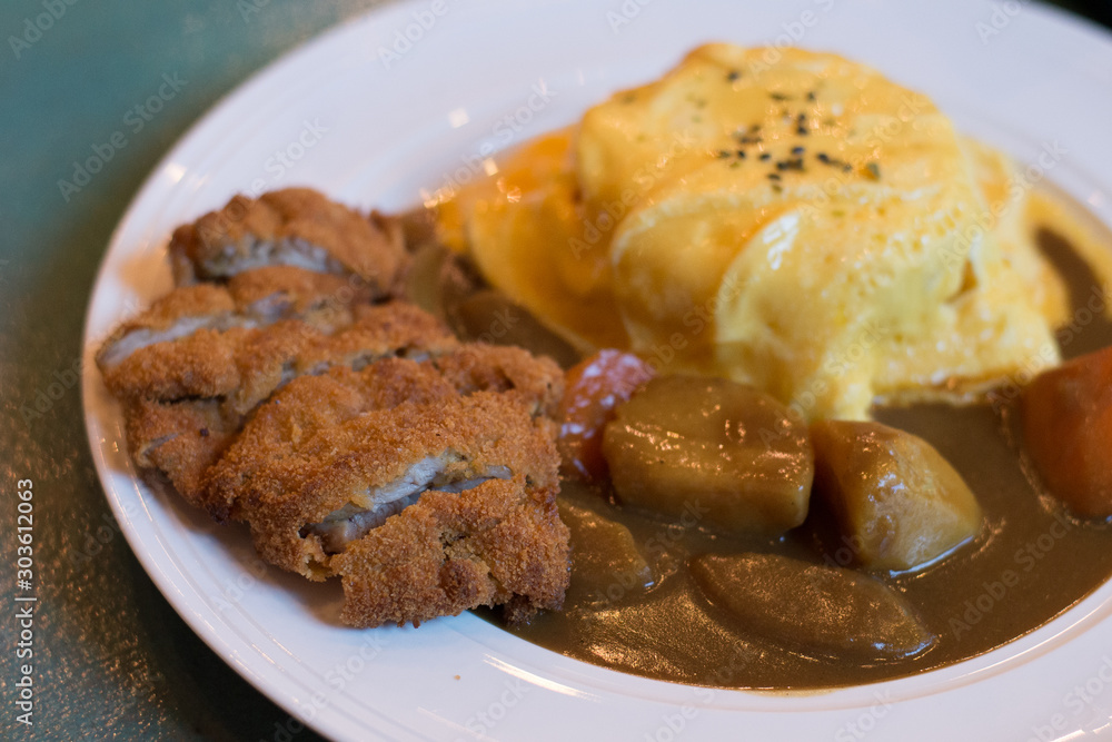Japanese chicken curry with potatoes and egg omelette rice Japanese chicken curry with potatoes and egg omelette rice