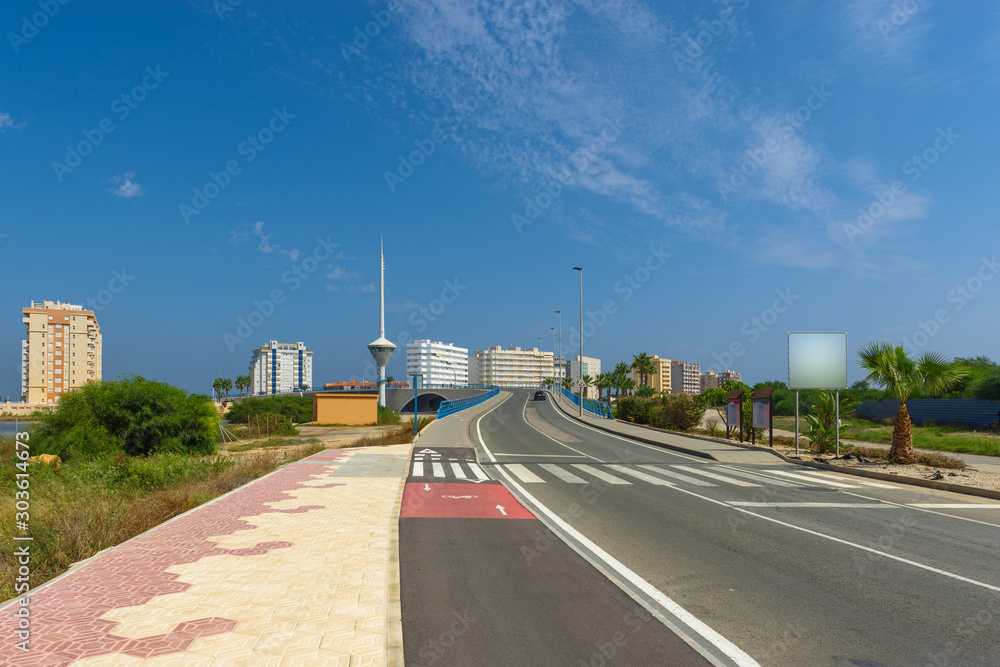 Highway and drawbridge in Mar Menor at the height of a hot day.