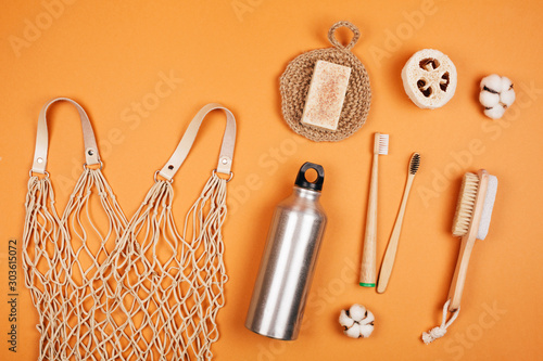 Zero waste living concept. Special objects on orange pastel background photo