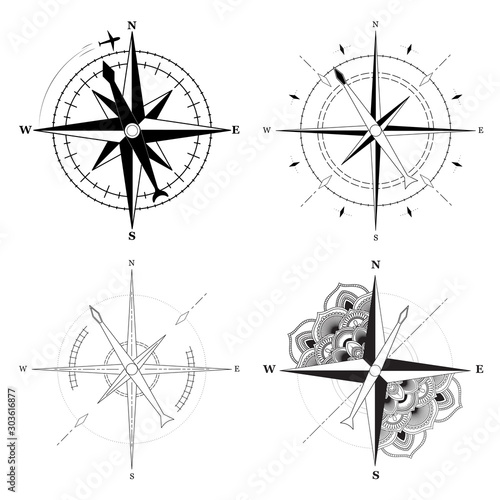 Simple signs of compasses set on white background. Vector illustration