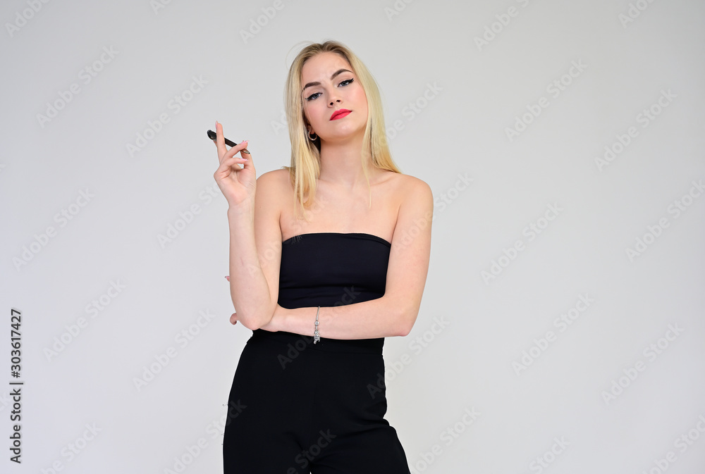 Business training concept with a girl secretary. Portrait of a fashionable beautiful blonde model with long hair, great makeup, on a white background. Business training concept with a girl secretary. Portrait of a fashionable beautiful blonde model with long hair, great makeup, on a white background.