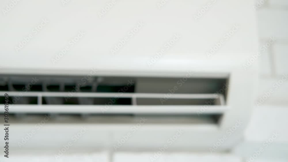 The work of a home air conditioner. Working blades of the air conditioner. The work of a home air conditioner. Working blades of the air conditioner.