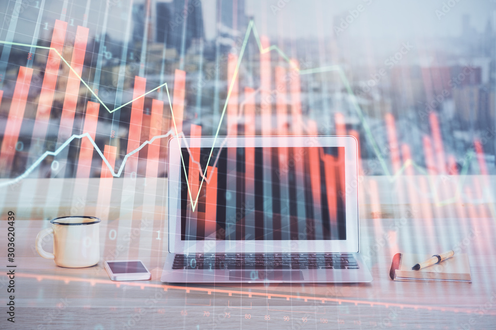 Financial market graph hologram and personal computer on background. Multi exposure. Concept of forex. Financial market graph hologram and personal computer on background. Multi exposure. Concept of forex.