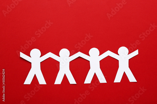 Paper chain people on red background