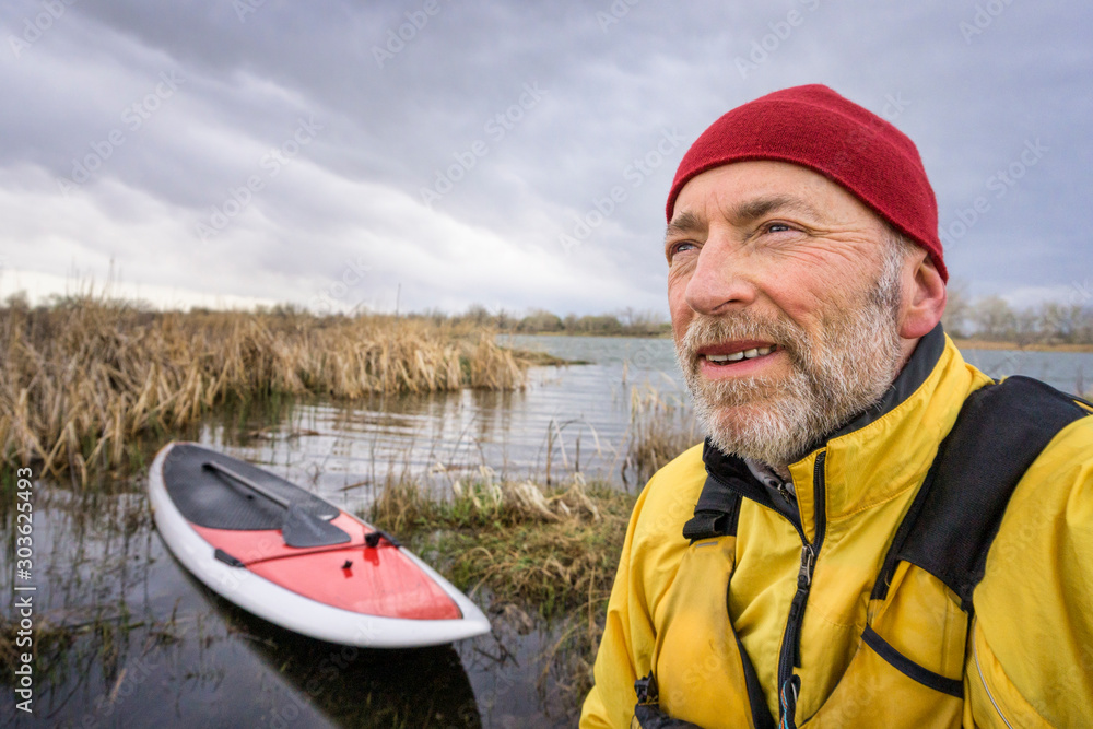 senior SUP paddler environmental  portrait