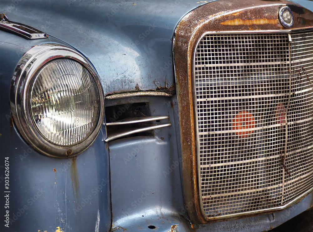 blue old vintage car with headlight close up