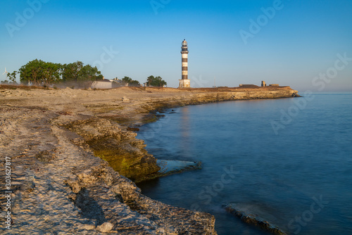 Lighthouse and hause on the small island in the Baltic Sea. Architecture on the Osmussaar, Estonia, Europe.