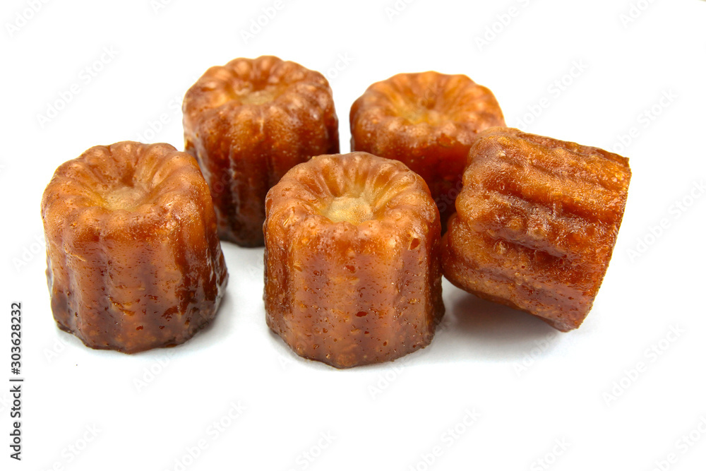 several cannelés on a white background several cannelés on a white background
