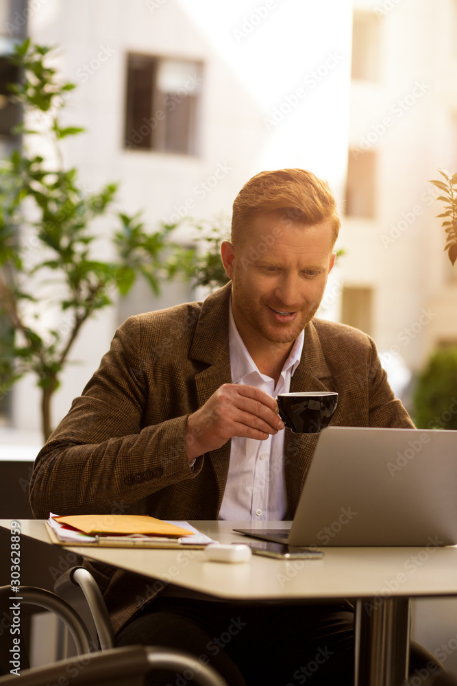 Curious man drinking coffee during lunch time stock photo Curious man drinking coffee during lunch time stock photo