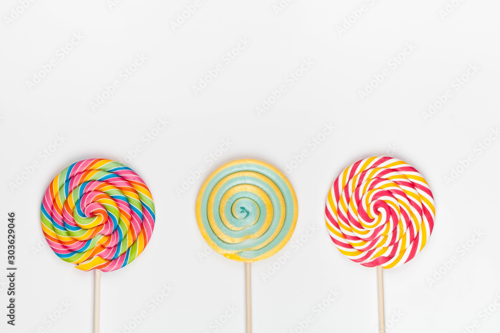 rainbow color lollipops on white background rainbow color lollipops on white background