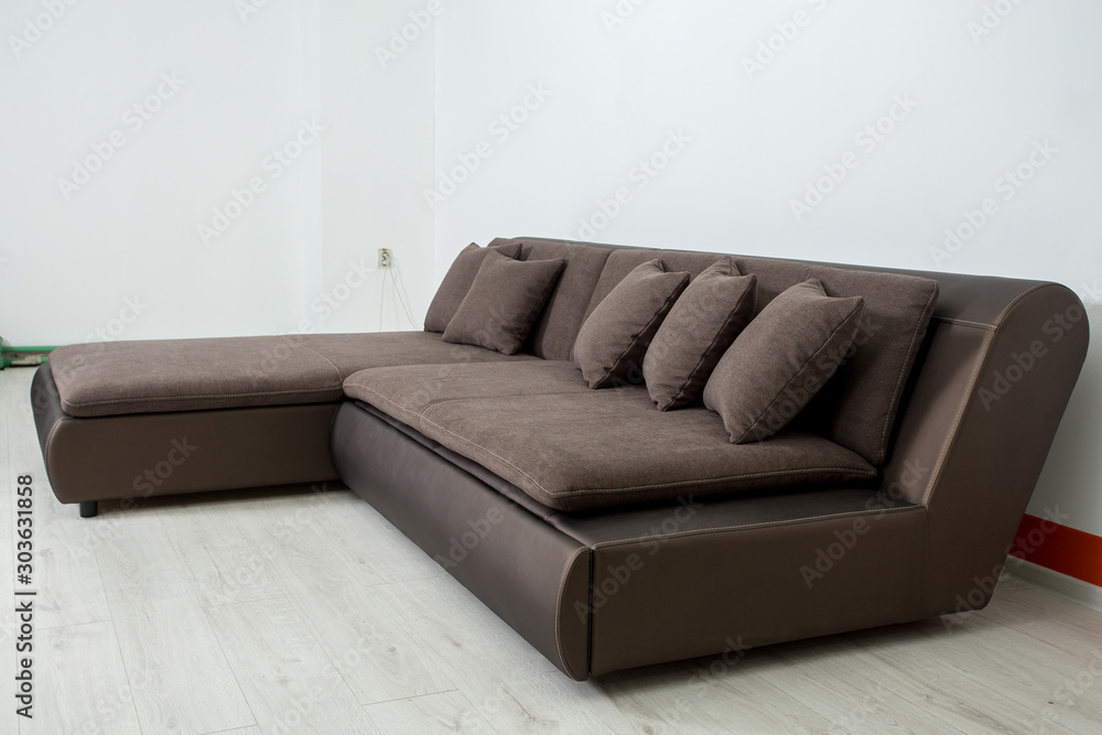 angular brown leather sofa on a white background