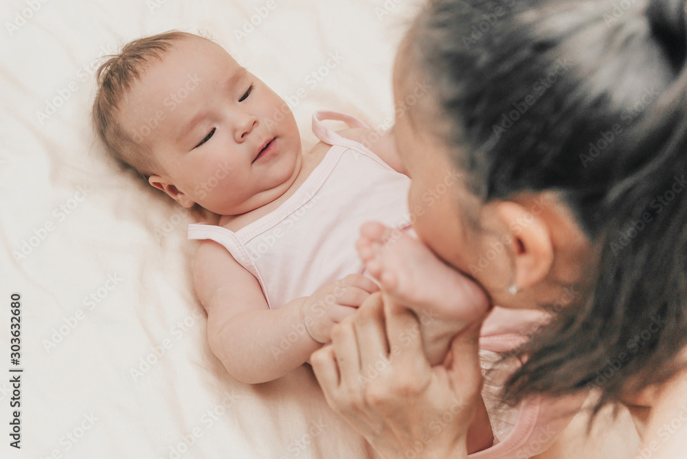portrait of a happy mother and child. the moment of closeness of the baby and mother portrait of a happy mother and child. the moment of closeness of the baby and mother