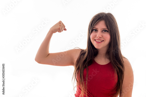Caucasian young girl with glasses with gym weights and smiling on white background isolated