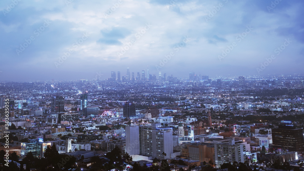 Dramatic View Of Los Angeles At Night. Beautiful Sky With Clouds. Location: Los Angeles, California.  Travel, cyber / futuristic, megacities concept. 