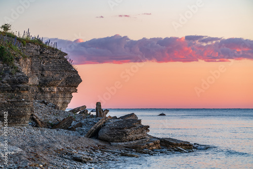 Stone wall on the Baltic sea in the summer. Pakri coast, island in Estonia, Europe.