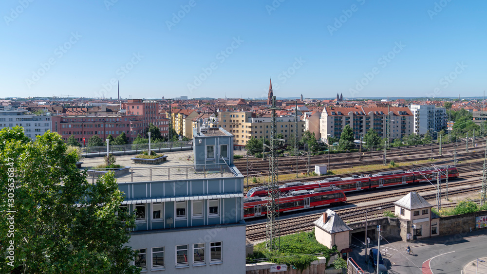 nuremberg train station cityscape with houses and trains, germany