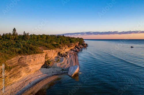 Stone wall on the Baltic sea in the summer. Pakri coast, island in Estonia, Europe. photo