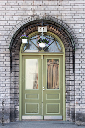 old green door and brick wall in the old town in Tallinn