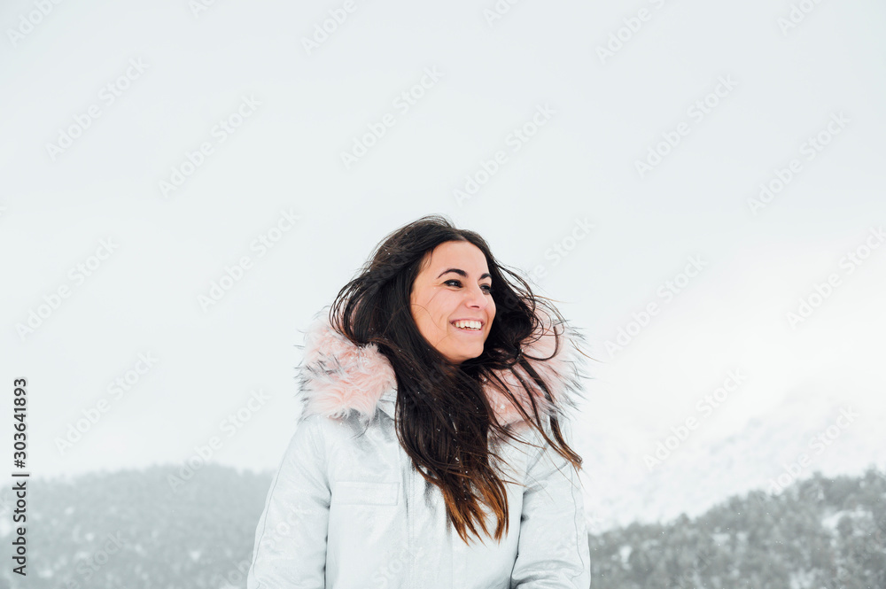 Young woman in snowy landscape