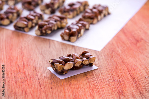 almond brittle croquand on a wooden surface
