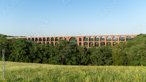  historic goeltzsch viaduct landscape / very old train bridge made from bricks on a sunny day, germany