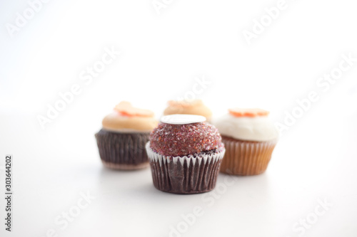 Four cupcakes in white background