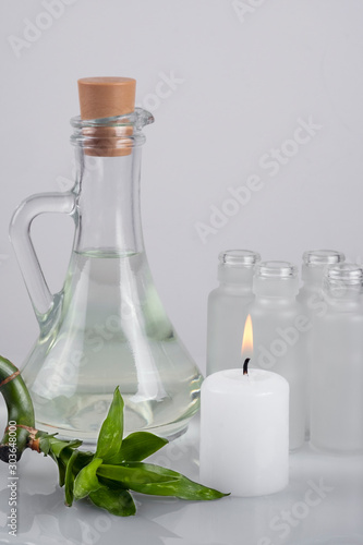 Home cosmetics made at home. Tonic, herbal tincture, pharmacy bottles and decorative candle