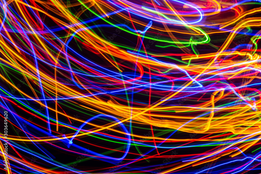 Εκτύπωση καμβά Colorful lights on the long exposure with motion background, Abstract glowing colorful lines, slow speed shutter