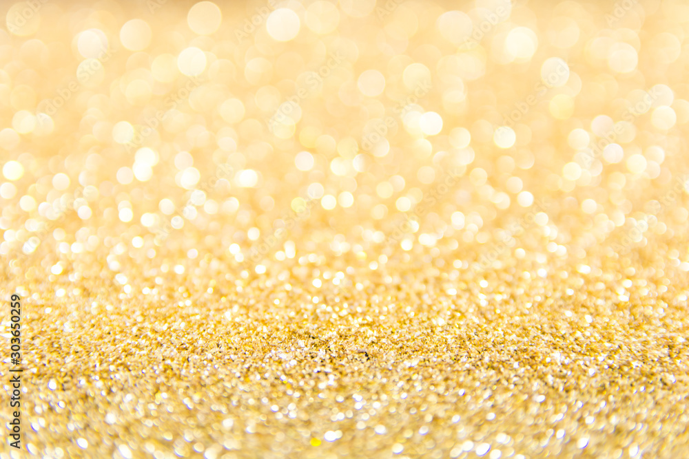 Defocused gold glitter background. Gold abstract bokeh background. Christmas abstract background. Defocused gold glitter background. Gold abstract bokeh background. Christmas abstract background.