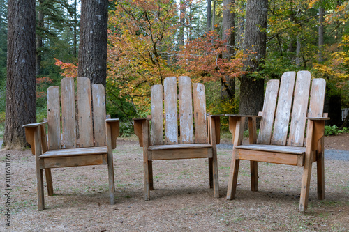 Three Adirondack chairs wait for weary hikers at Silver Falls State Park near Silverton, Oregon. photo