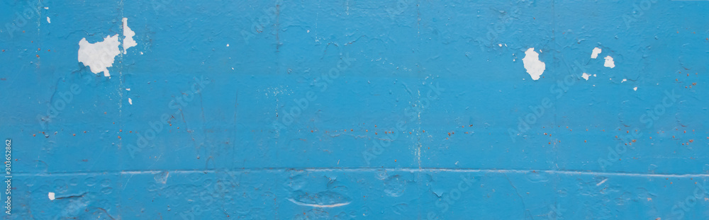 Texture of old peeling paint, vintage graffiti background, it's time to make repairs, cracked paint texture. white, blue old paint. Clipart, panoramic photo