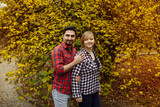 Loving couple in plaid shirts.